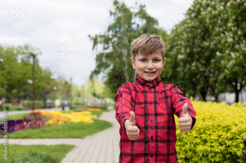 happy little boy in the red shirt