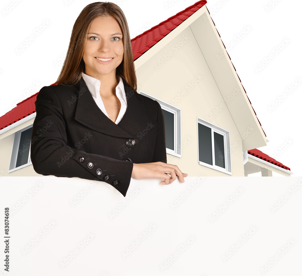 Woman standing against background of country house hold down Woman standing against background of country house hold down