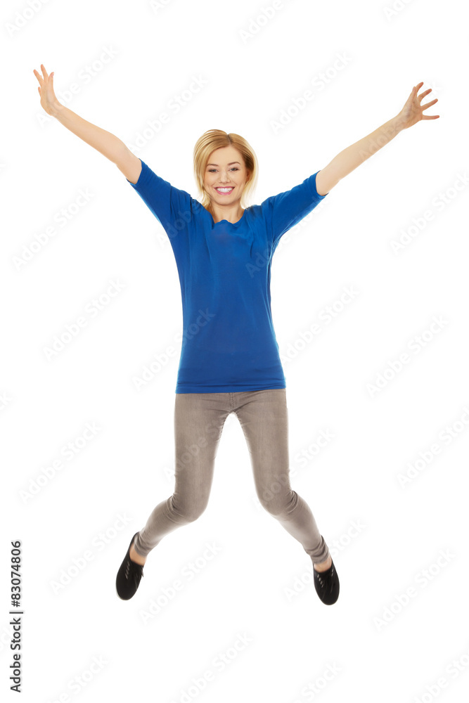 Young casual woman jumping. Young casual woman jumping.