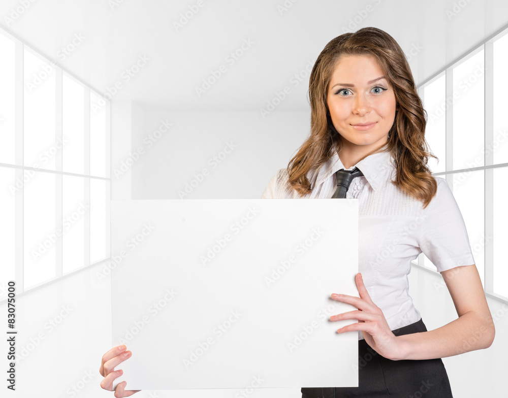 Office girl standing on background of light interior and is Office girl standing on background of light interior and is