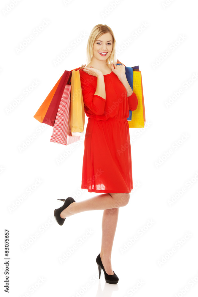 Woman with a lot of shopping bags.