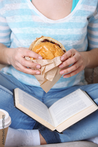 Woman with unhealthy fast food  close-up