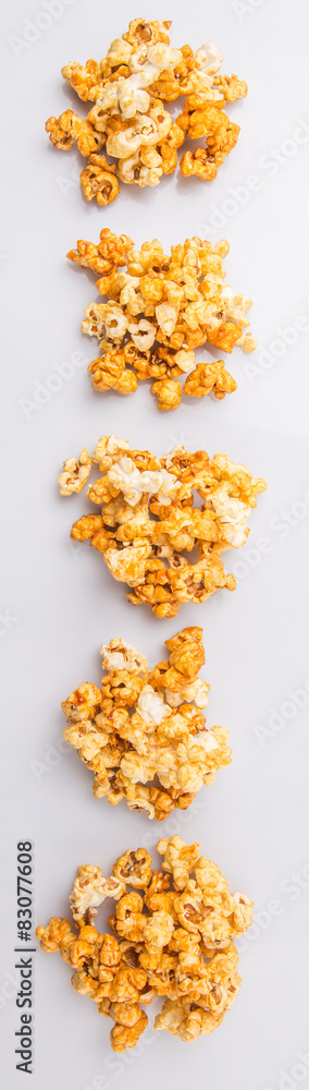 Caramel popcorn over white background Caramel popcorn over white background