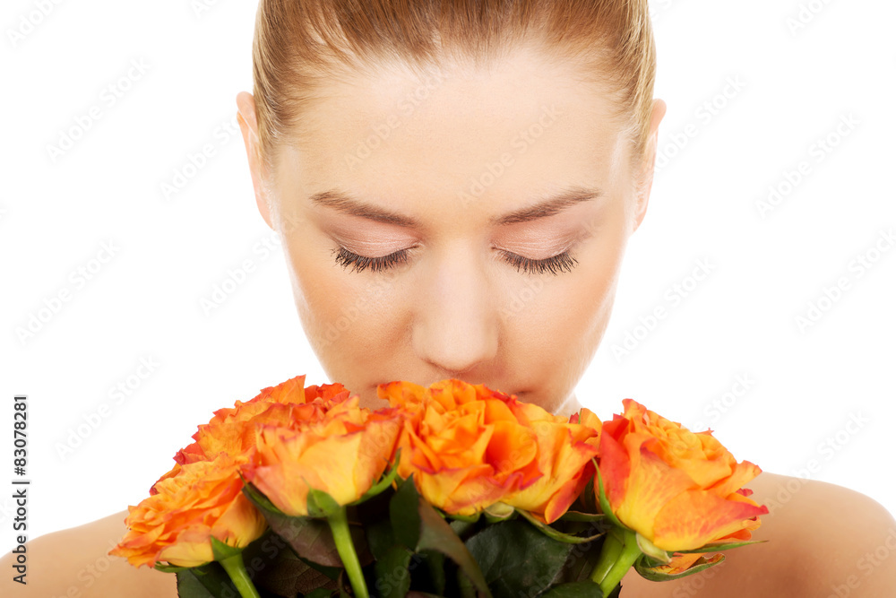 Fototapeta premium Smiling woman with fresh roses.