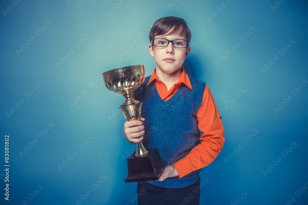 European-looking  boy of  ten years in glasses holding a cup, aw