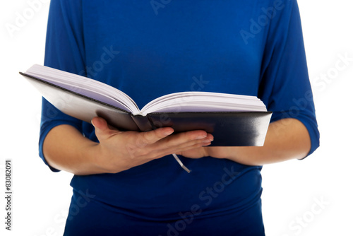 Young woman reading a book.