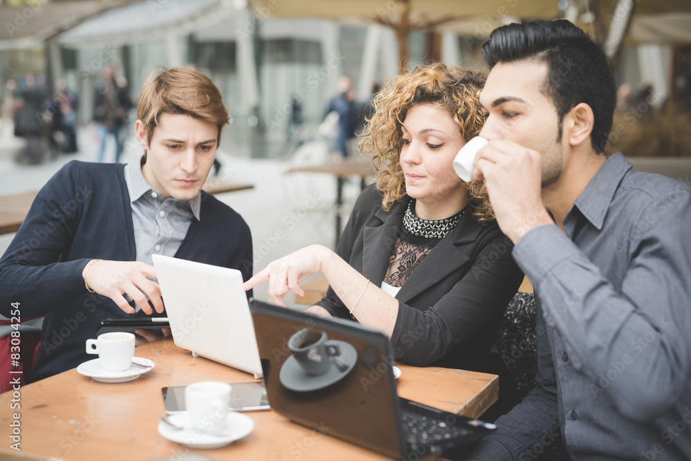 Multiracial business people working outdoor in town Multiracial business people working outdoor in town