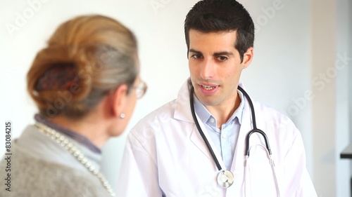 A doctor talks with a female patient