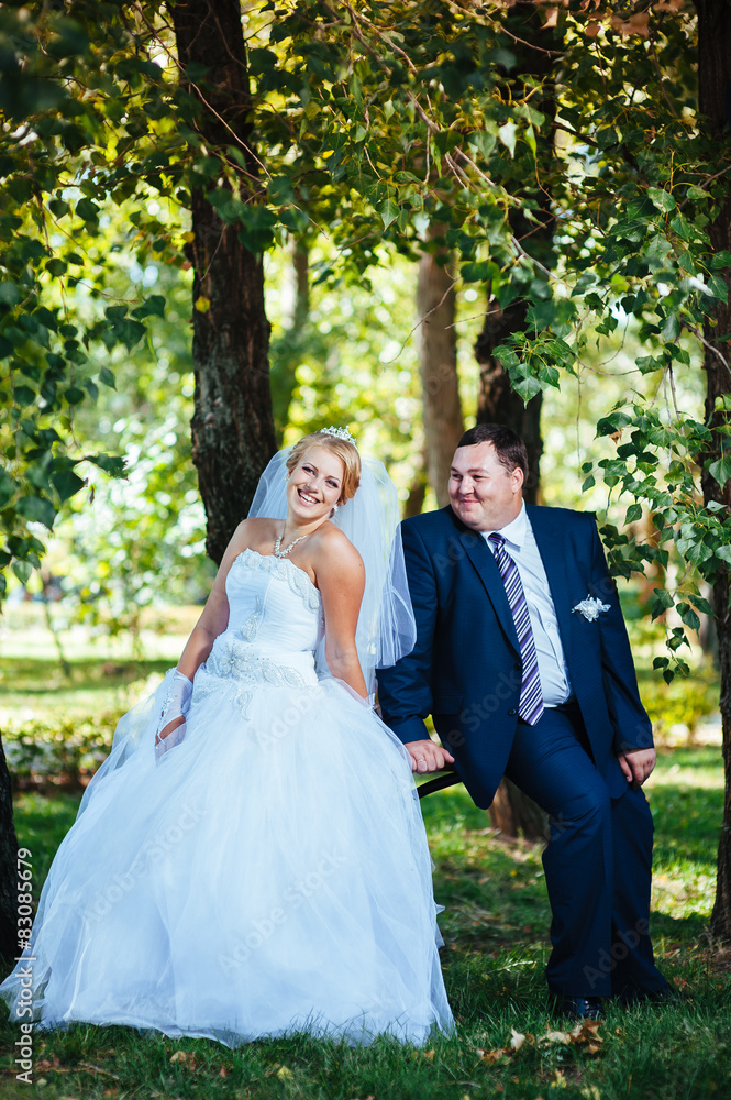 Bride and Groom at wedding Day walking Outdoors on spring nature Bride and Groom at wedding Day walking Outdoors on spring nature
