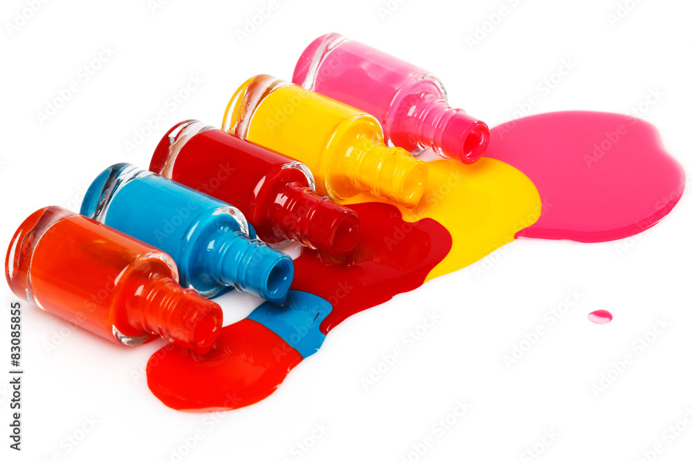Bottles with spilled nail polish Bottles with spilled nail polish