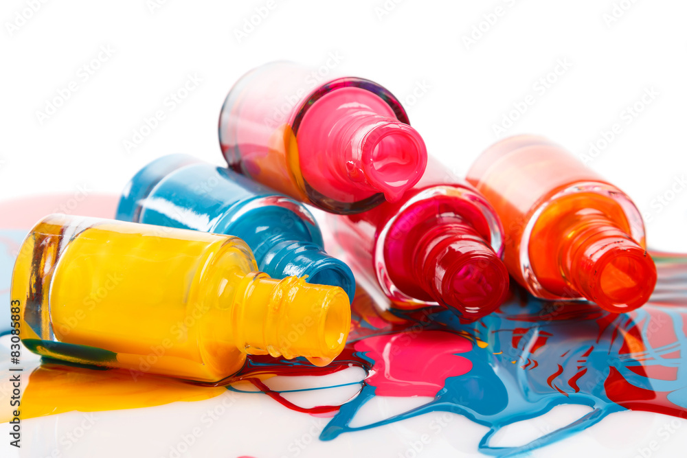 Bottles with spilled nail polish Bottles with spilled nail polish