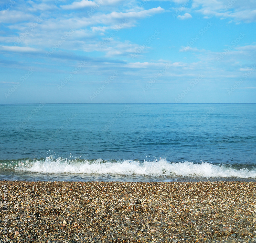 calm sea with pebble coast