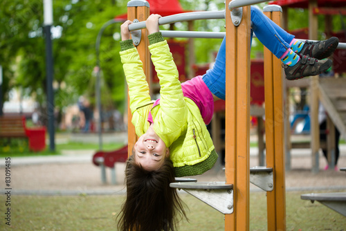 Tablou pe pânză Girl is playing on playground