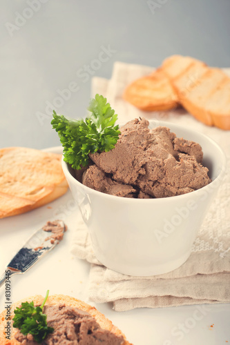 Healthy chicken liver pate with parsley in bawl
