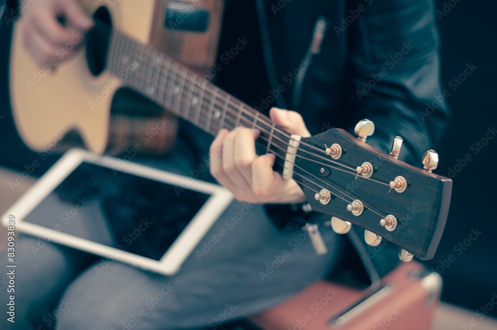 Fototapeta premium Human hand playing an electric guitar