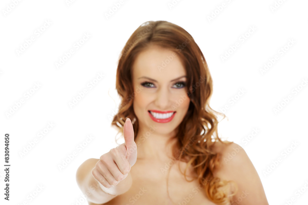 Woman in swimming bra with thumbs up. Woman in swimming bra with thumbs up.