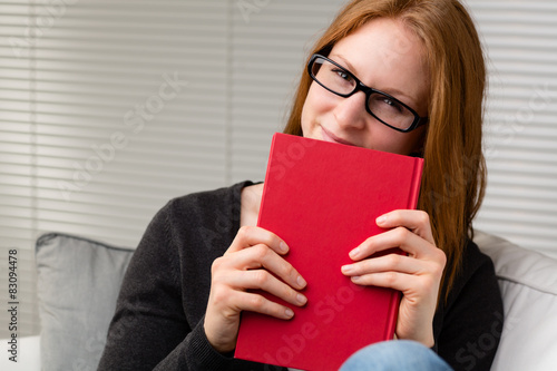 Woman Holding a Red Book