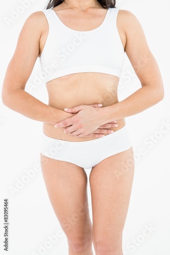 Fit woman suffering stomach pain 