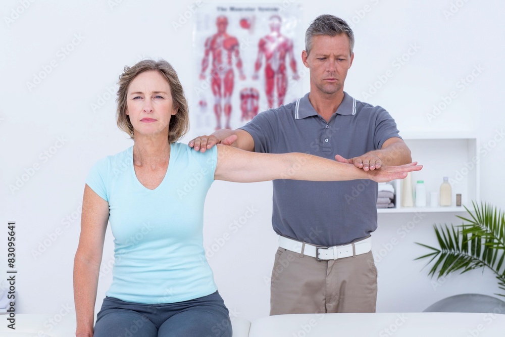 Doctor examining his patient arm Doctor examining his patient arm
