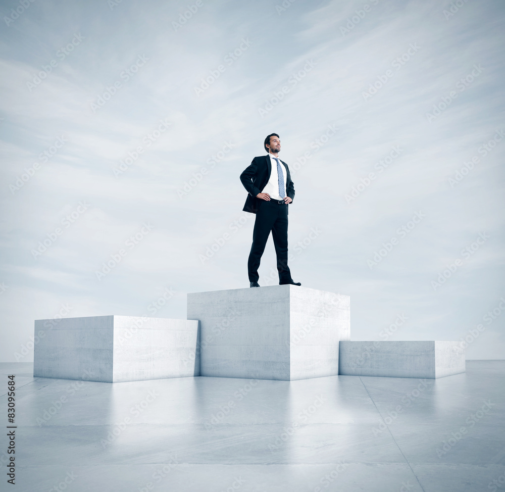 Businessman standing on a highest cube. 3d rendering Businessman standing on a highest cube. 3d rendering