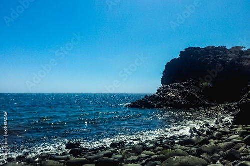 stone beach shore on Atlantic ocean in Tenerife island Spain