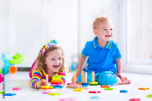 Cjildren playing with wooden toys