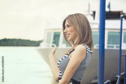 Woman at the dock waving goodbye