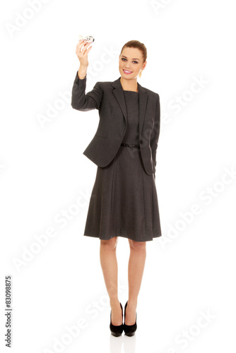 Business woman holding airplane model.