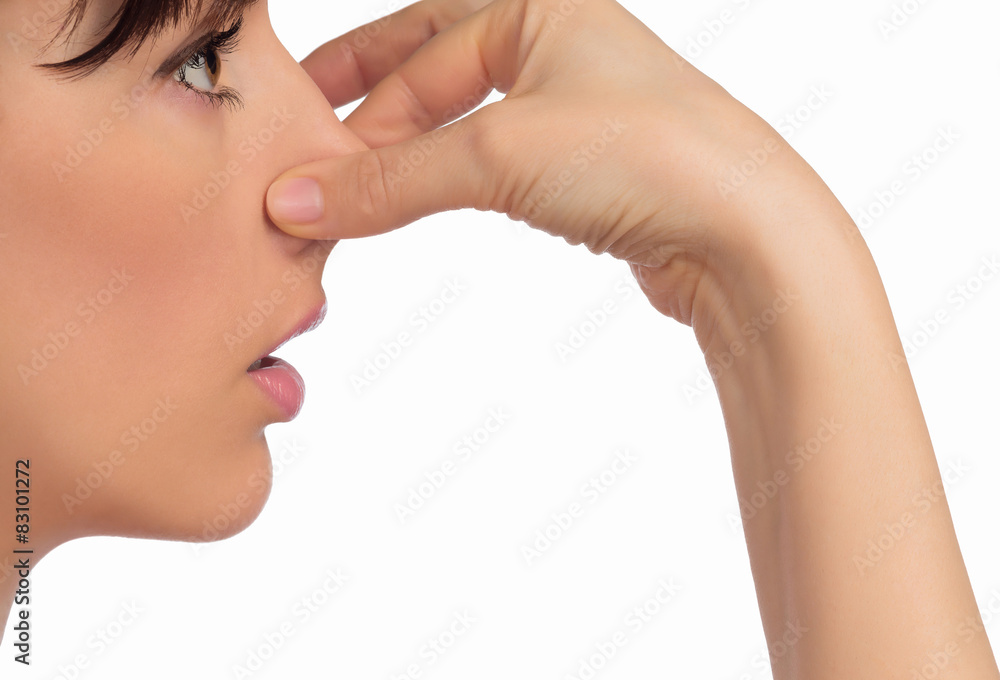 Fototapeta premium Image with woman's face holding her nose with hand