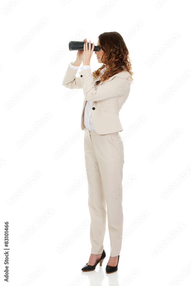 Businesswoman looking through binoculars. Businesswoman looking through binoculars.