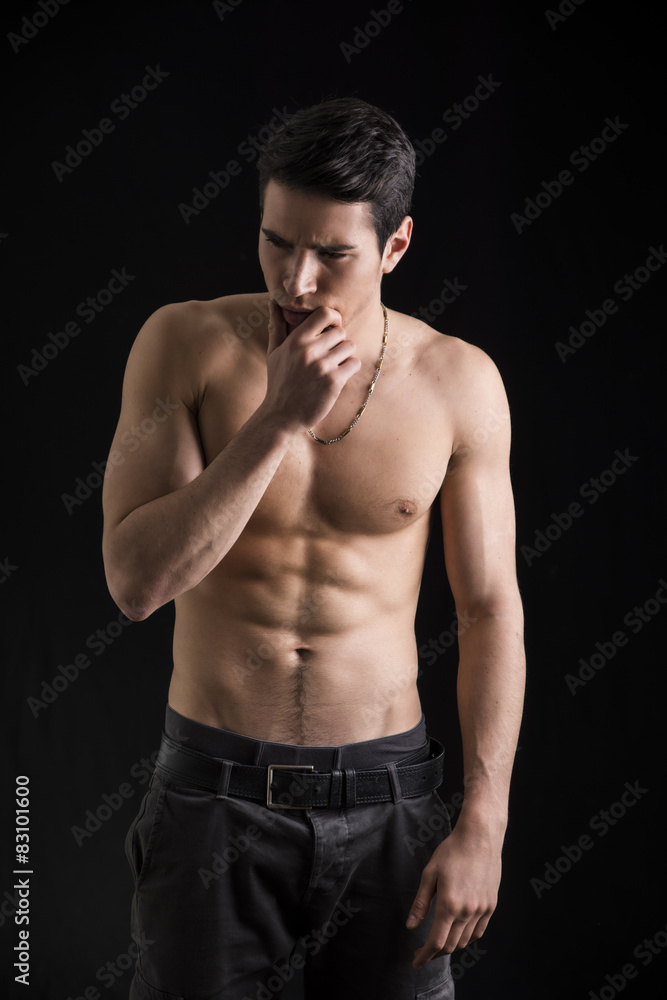 Wondering handsome shirtless young man thinking unsure