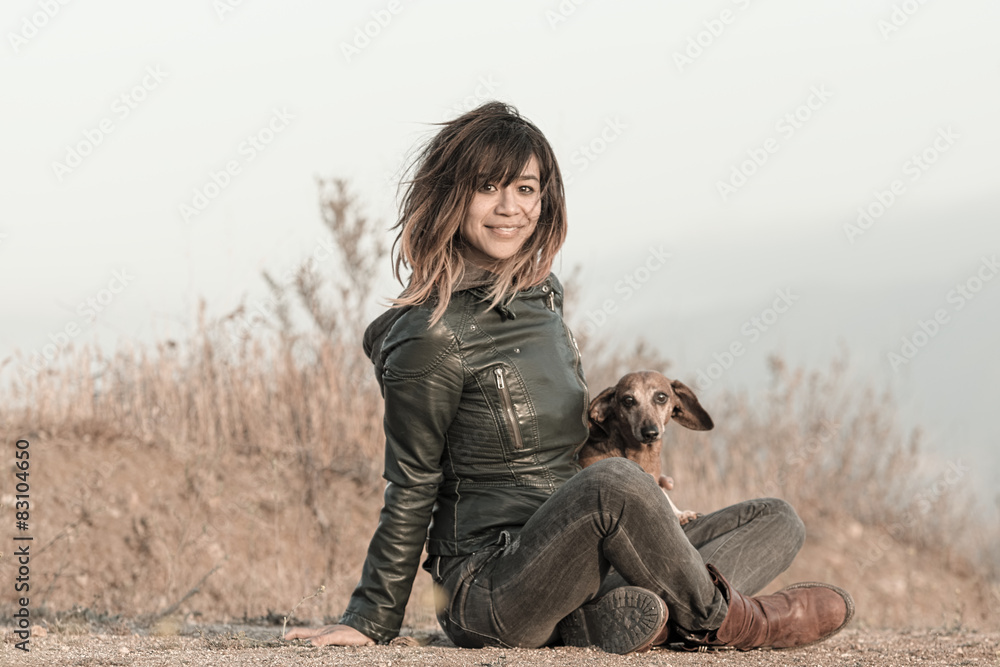 Seated woman with leather jacket and Dachshund
Seated woman with leather jacket and Dachshund