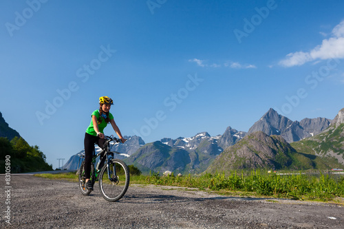 Fototapeta Naklejka Na Ścianę i Meble -  Biking in Norway against picturesque landscape
