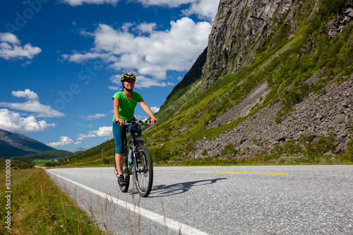 Fototapeta Naklejka Na Ścianę i Meble -  Biking in Norway against picturesque landscape