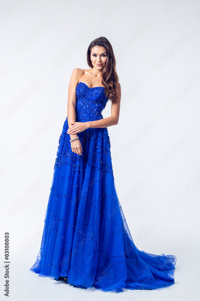 Young woman in a beautiful blue evening dress Young woman in a beautiful blue evening dress