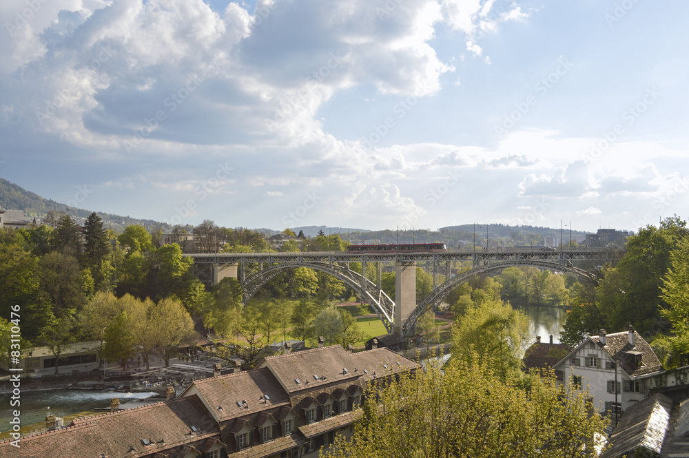 Fototapeta premium Bern and his train, river Aare, trees and rooftops, Europe