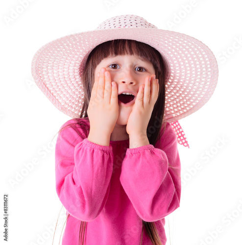 Wondering girl wearing pink sun hat