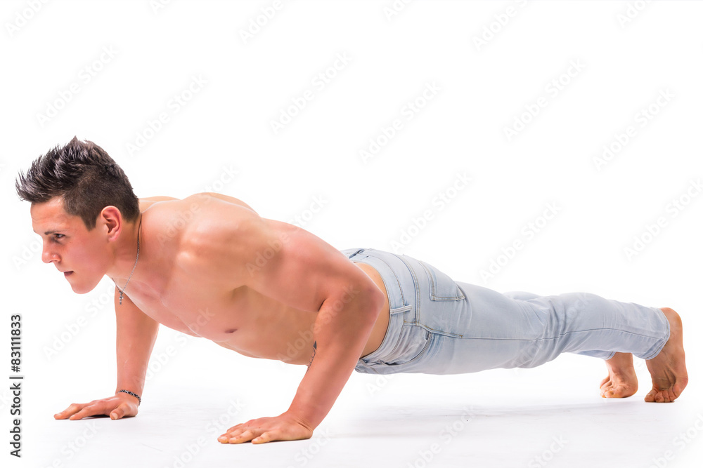Handsome shirtless bodybuilder doing push-ups in studio shot Handsome shirtless bodybuilder doing push-ups in studio shot