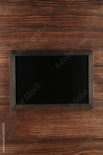 Wood frame on brown wooden background