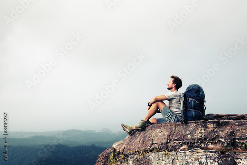 Hiker relaxing on the rock