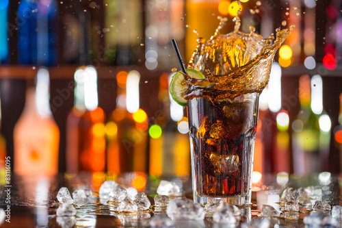 Glass of cola on bar desk