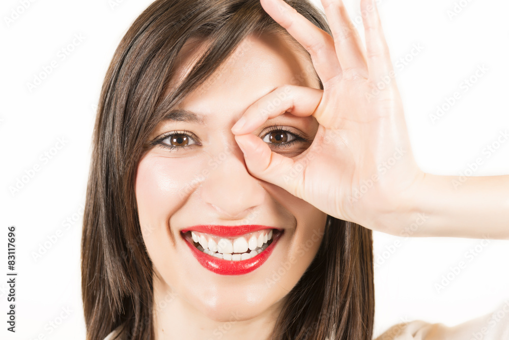 Happy smiling young woman showing okay gesture Happy smiling young woman showing okay gesture