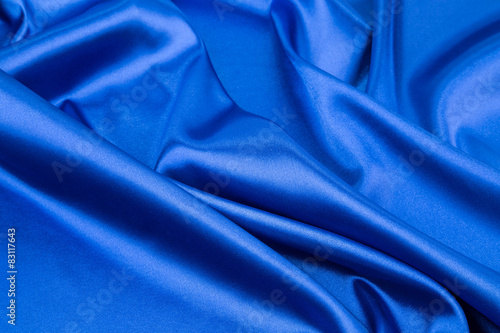 Blue silk drapery close up.