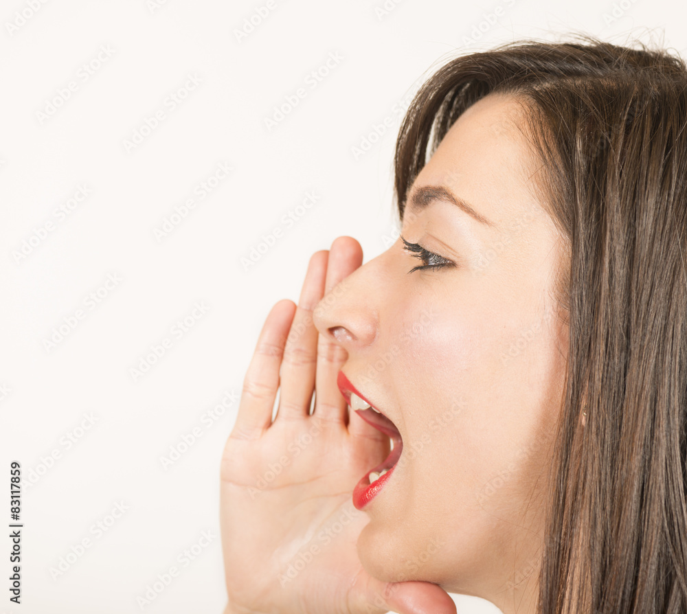 Young woman shout and scream using her hands as tube Young woman shout and scream using her hands as tube