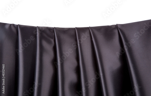 Soft folds of black silk cloth.