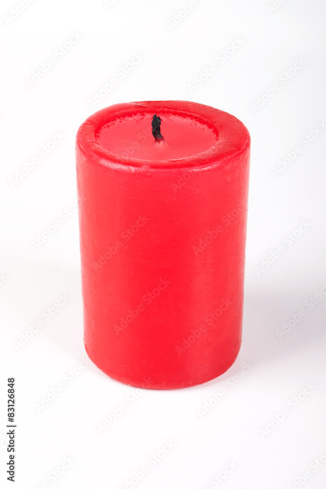 Red candle on a white background Red candle on a white background