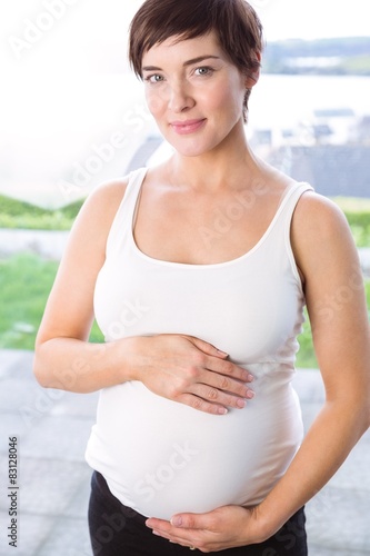 Free Download Pregnant woman holding her bump - GFXLoad