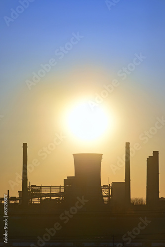 silhouette of industrial factory at sunset