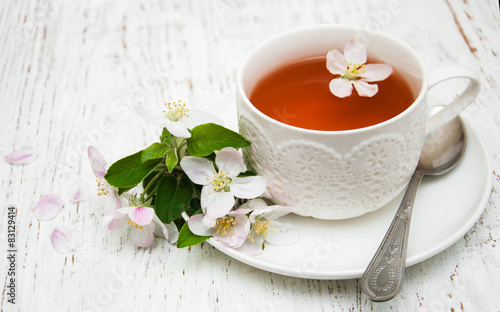 Cup of tea and spring blossom
