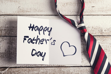 Fathers day composition. Studio shot on white wooden background